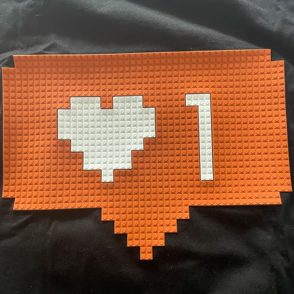 Mostly Heard Rarely Seen Black Tee with Orange and White Graphic - Picture 2 of 4
